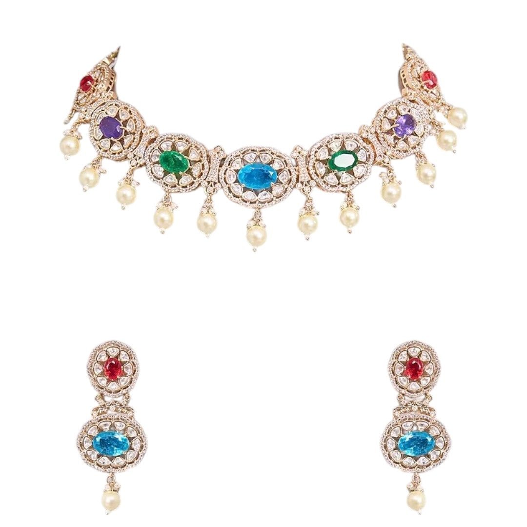 Traditional Gold - Tone Pearl Drop Multicolor Choker Necklace Set with Earrings for Women - Auraa Trends - Necklace Set - - Auraa Trends - Woman wearing a gold - tone multicolor gemstone choker necklace with pearl drops and matching earrings, styled with an embroidered saree blouse.