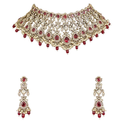 "Antique gold Kundan net choker necklace with ruby red stones and pearl bead drops, matching chandelier earrings"