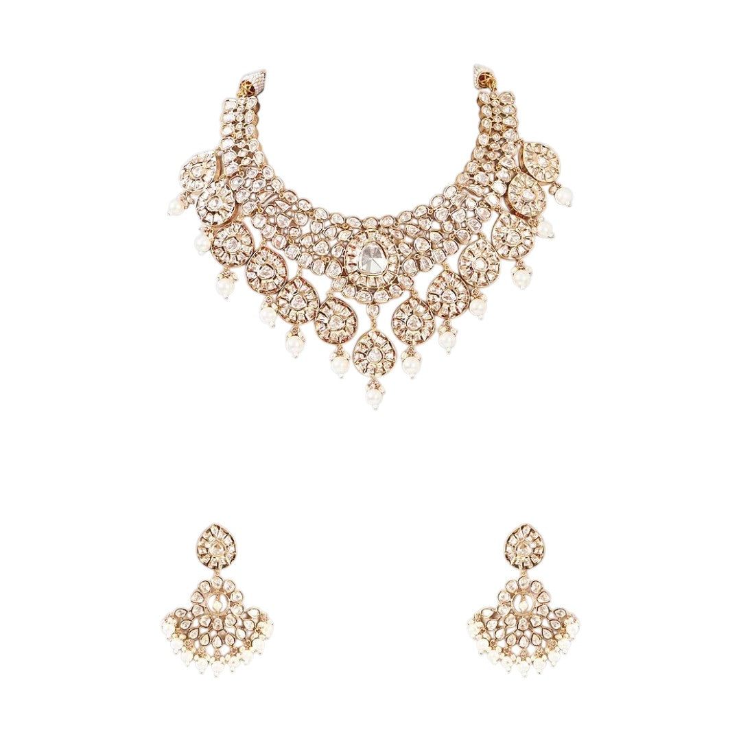 Gold-tone polki kundan choker necklace with teardrop medallions and pearl drops, shown with matching chandelier earrings