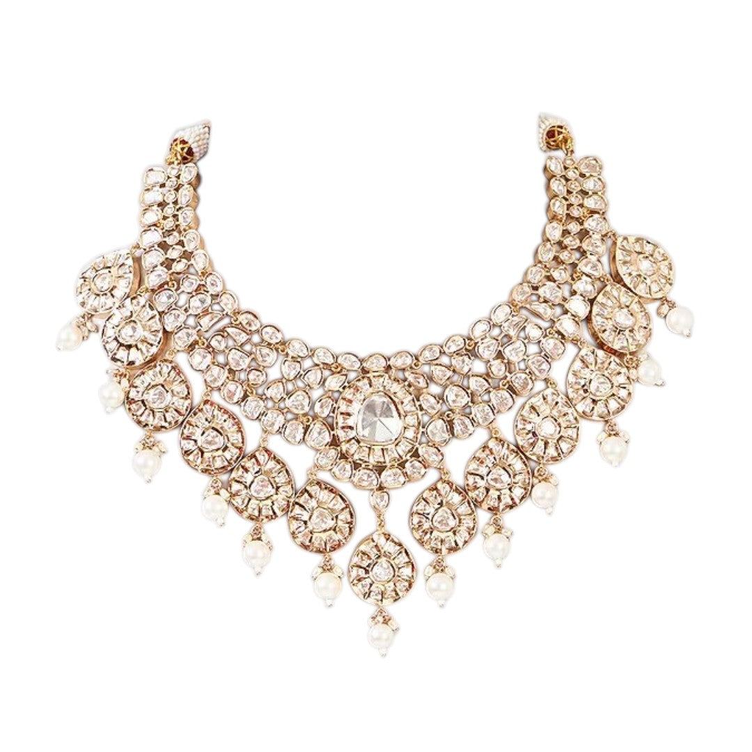 Gold-tone polki kundan choker necklace with teardrop medallions and pearl drops, shown with matching chandelier earrings