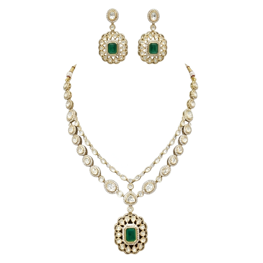 Double layer kundan necklace set with emerald-green pendant and matching kundan drop earrings
