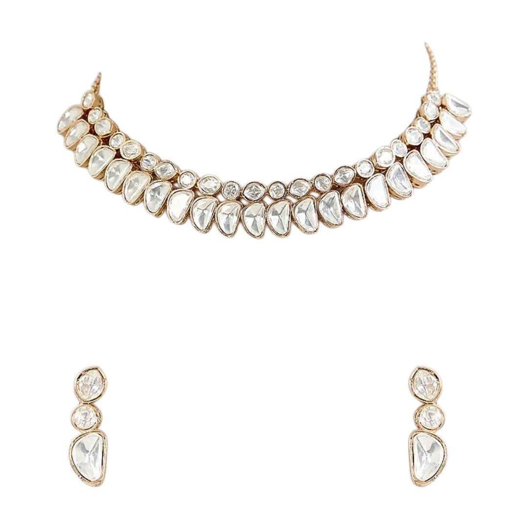 Luxury gold-tone Kundan statement necklace with clear uncut stones in an elegant crescent design for bridal and wedding jewelry.