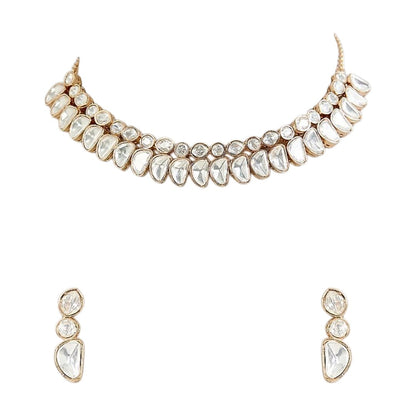 Luxury gold-tone Kundan statement necklace with clear uncut stones in an elegant crescent design for bridal and wedding jewelry.