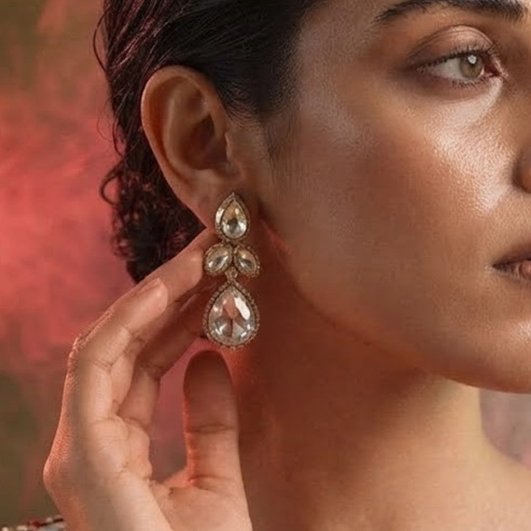"Gold-plated teardrop crystal earrings with leaf cluster design and pear-shaped CZ drop, elegant party wear earrings on white background"