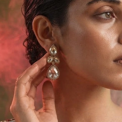 "Gold-plated teardrop crystal earrings with leaf cluster design and pear-shaped CZ drop, elegant party wear earrings on white background"
