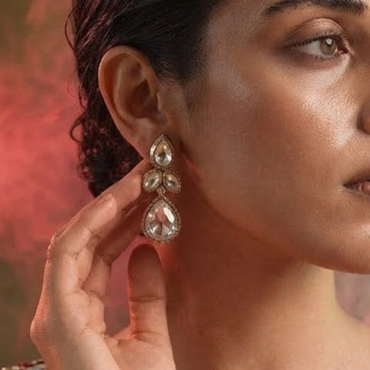 "Gold-plated teardrop crystal earrings with leaf cluster design and pear-shaped CZ drop, elegant party wear earrings on white background"