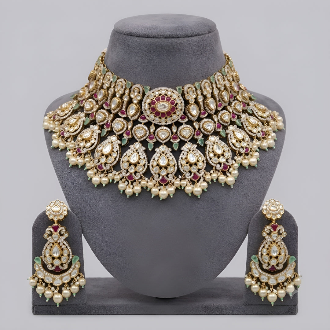 "Antique gold kundan polki bridal choker necklace set with ruby, emerald and pearl drops, paired with matching chandbali earrings"