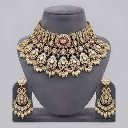 "Antique gold kundan polki bridal choker necklace set with ruby, emerald and pearl drops, paired with matching chandbali earrings"