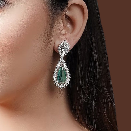 Emerald green teardrop dangle earrings with sparkling crystal floral halo design

