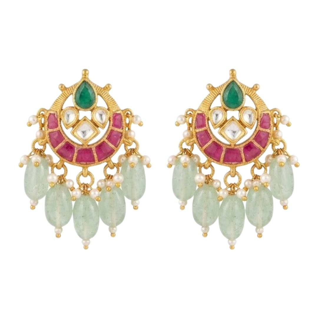 "Gold-plated Kundan Meenakari choker necklace and earring set with pearl and green bead drops, styled bridal jewellery on model"