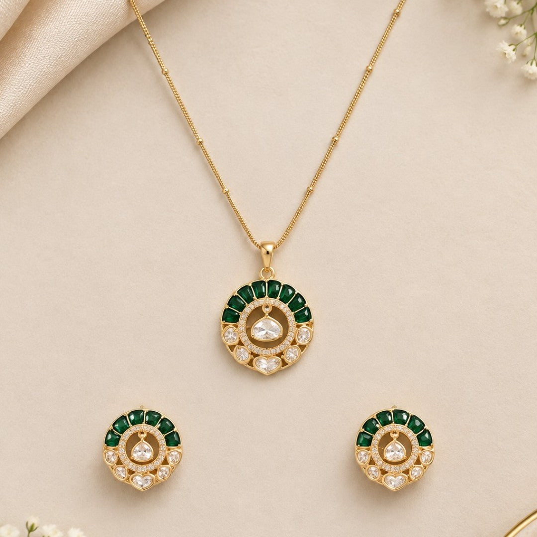 "Gold-tone kundan polki necklace and earring set with emerald-green enamel detailing and round uncut diamond-style pendant, on white background"