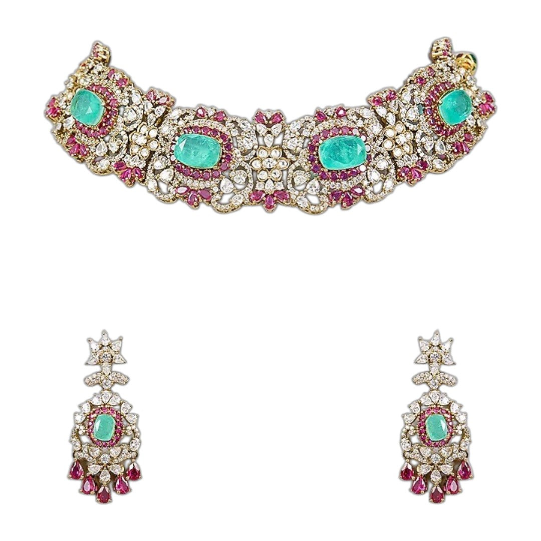 Luxury emerald green kundan choker necklace set with sparkling polki stones, ruby pink accents, and matching chandelier earrings for bridal and wedding wear.