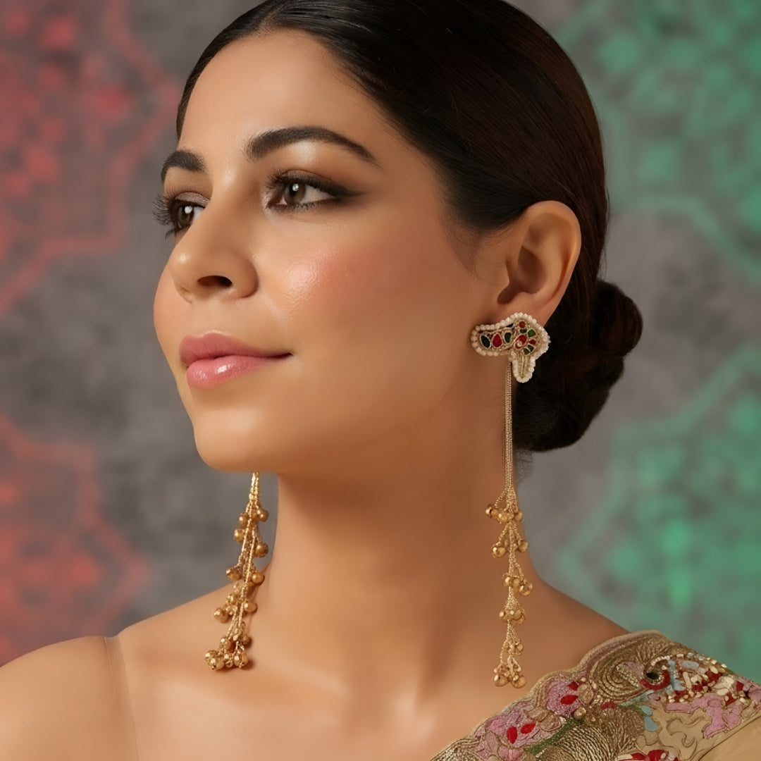 Antique gold kundan floral long earrings with red and green stone accents and layered ghungroo bead drops