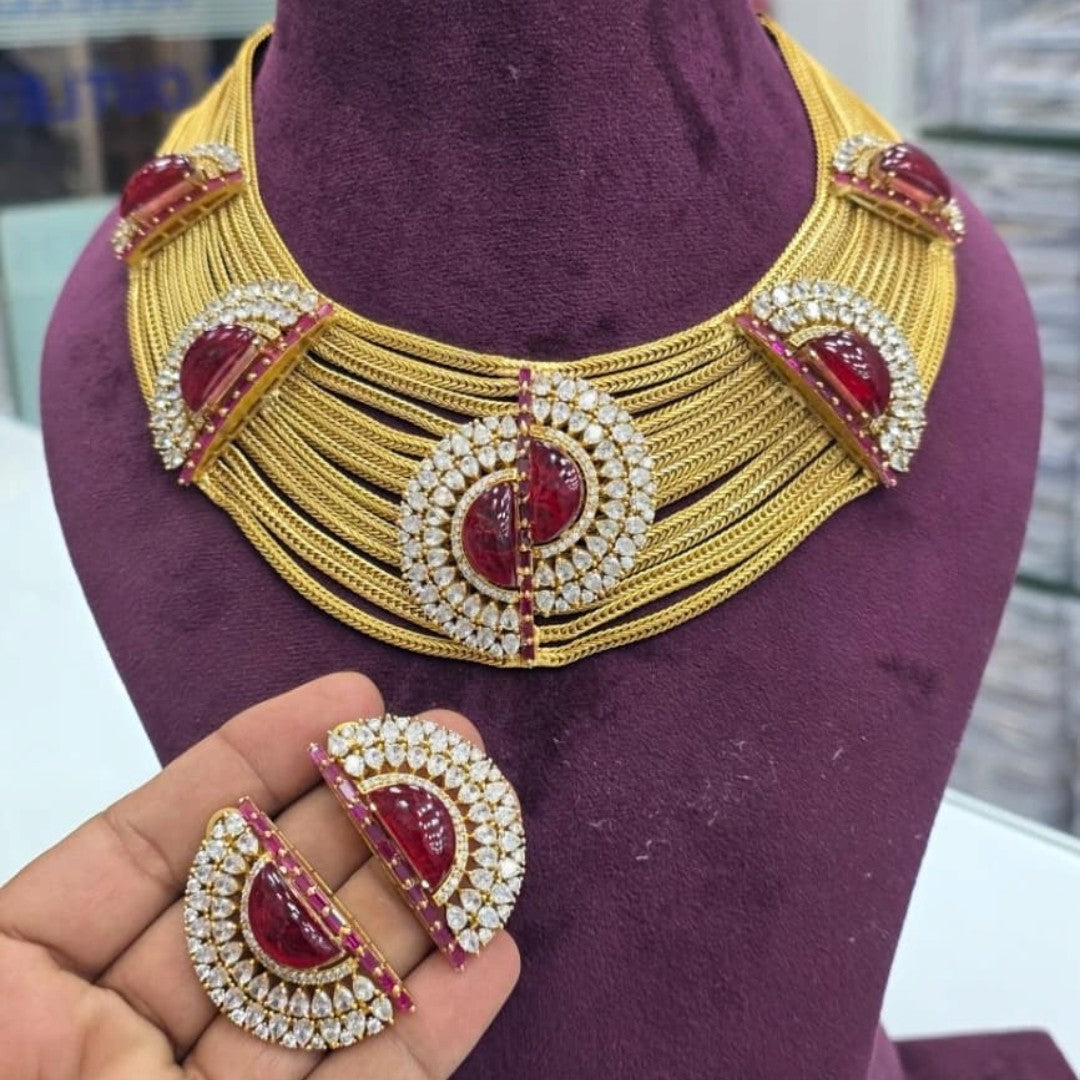 Gold plated ruby red multi-strand choker necklace set with American diamond half-moon medallions and matching earrings