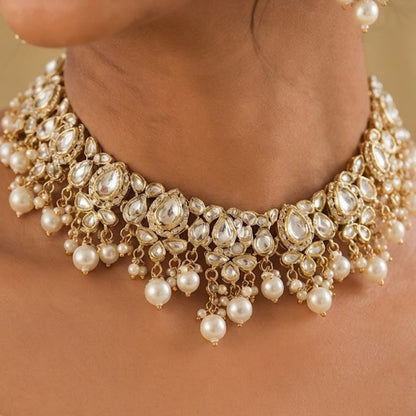 Gold-plated Kundan pearl choker necklace set with American diamond stones and matching pearl drop earrings for bridal, wedding, and festive wear.