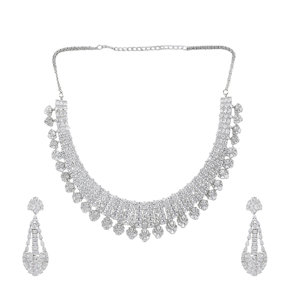 Silver American diamond necklace set with heart-shaped drop design and matching long earrings on white background