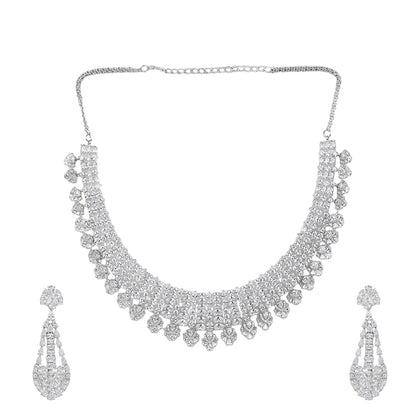 Silver American diamond necklace set with heart-shaped drop design and matching long earrings on white background