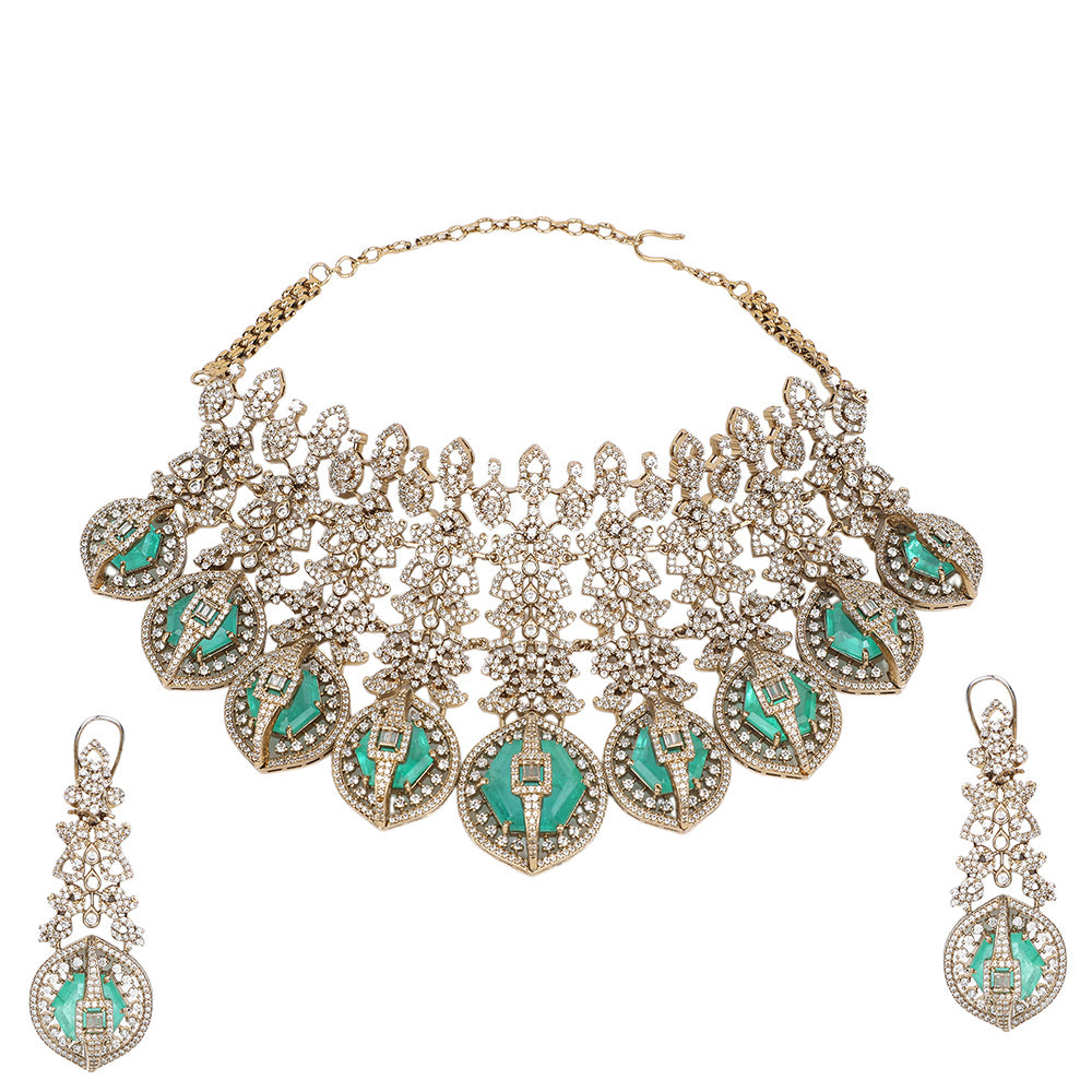 Gold plated choker necklace set with green stones and matching long earrings for bridal and party wear
