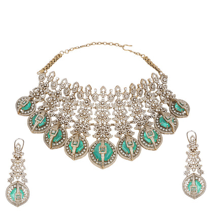 Gold plated choker necklace set with green stones and matching long earrings for bridal and party wear