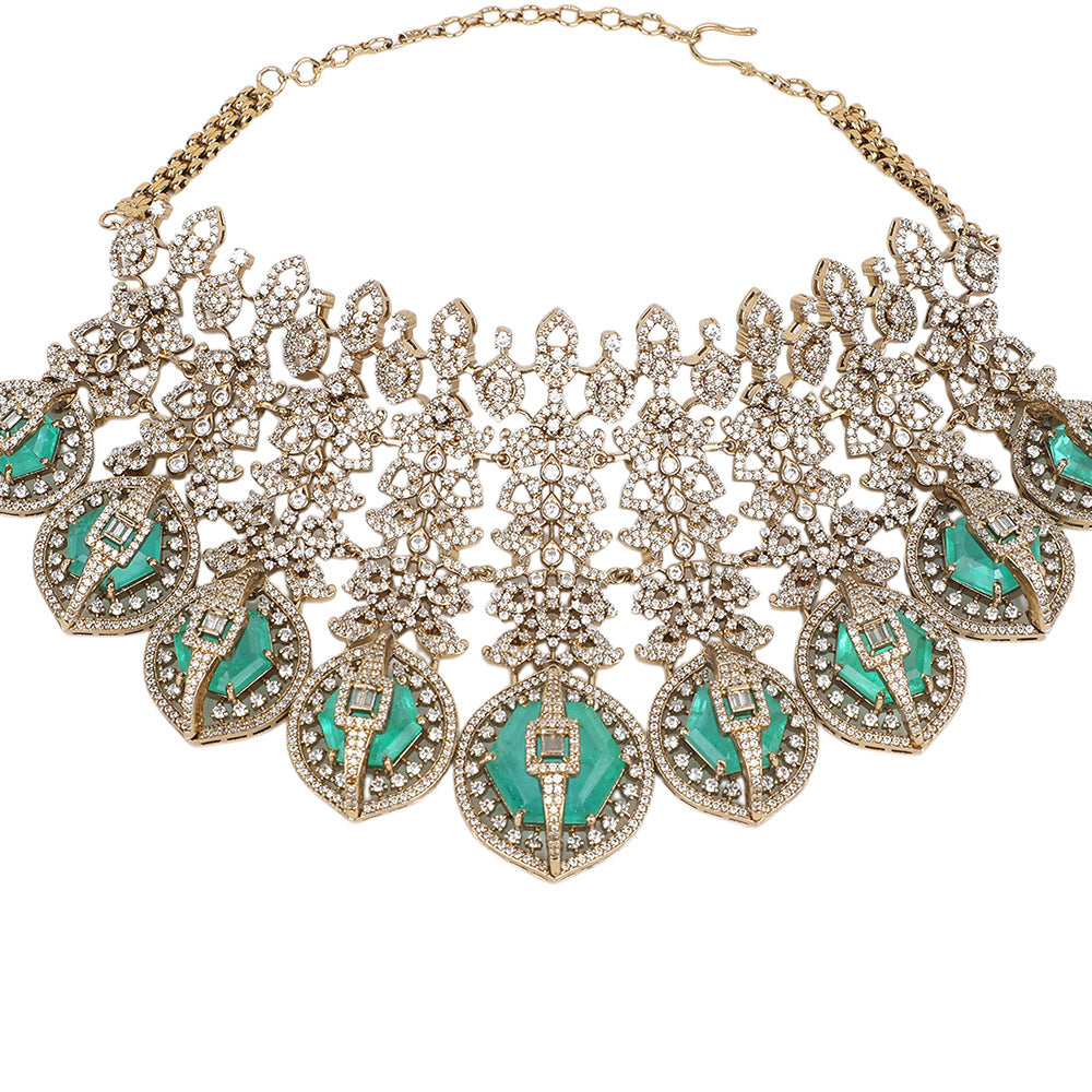 Gold plated choker necklace set with green stones and matching long earrings for bridal and party wear