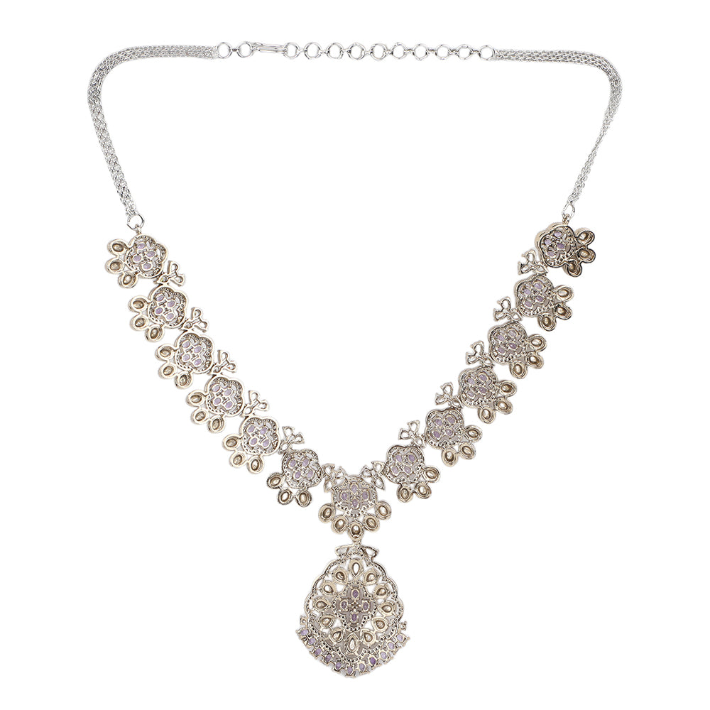 Silver plated necklace set with purple stones and matching earrings featuring intricate floral design for party and bridal wear
