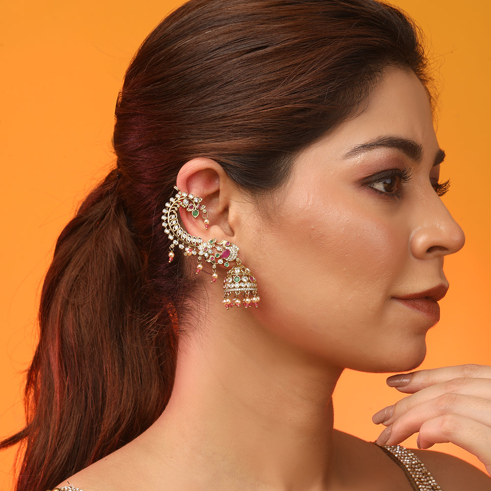 Traditional gold kundan jhumka earrings with pearl drops and colorful gemstones