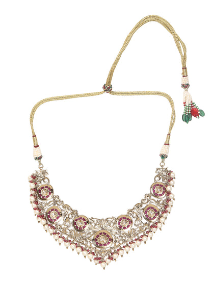 Gold-tone traditional necklace set with pink kundan-style stones, intricate detailing, pearl bead drops, and matching ornate dangling earrings.
