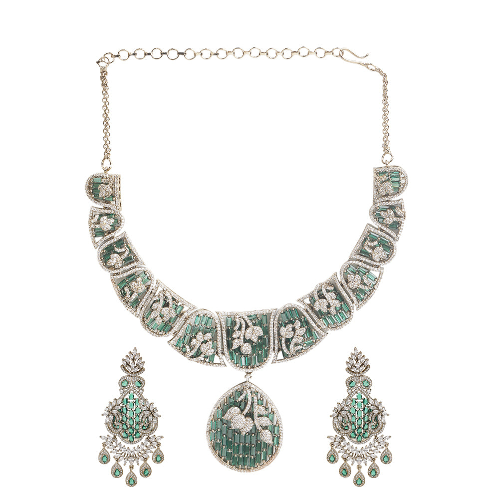 Gold plated statement necklace set with green stones and matching chandelier earrings for bridal and festive wear