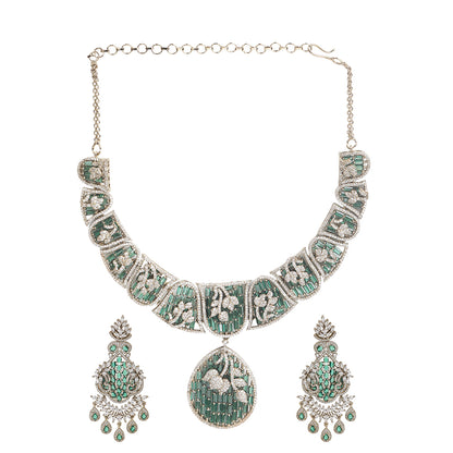 Gold plated statement necklace set with green stones and matching chandelier earrings for bridal and festive wear