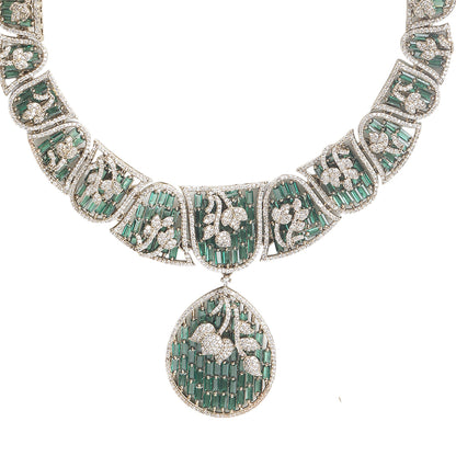 Gold plated statement necklace set with green stones and matching chandelier earrings for bridal and festive wear