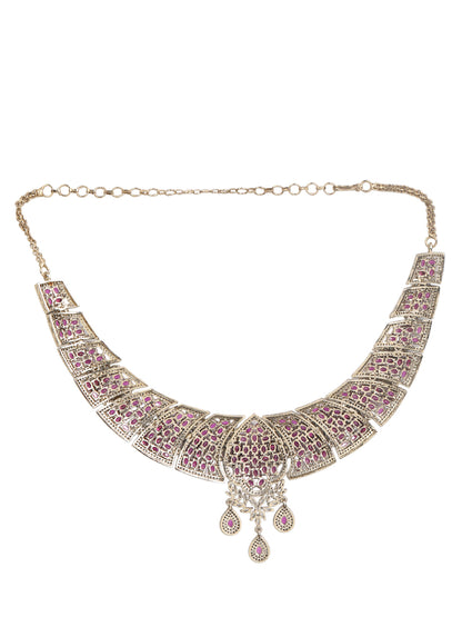 Gold-tone statement necklace set with pink ruby-style stones and clear crystals in an intricate floral design, paired with matching chandelier earrings featuring drop accents.