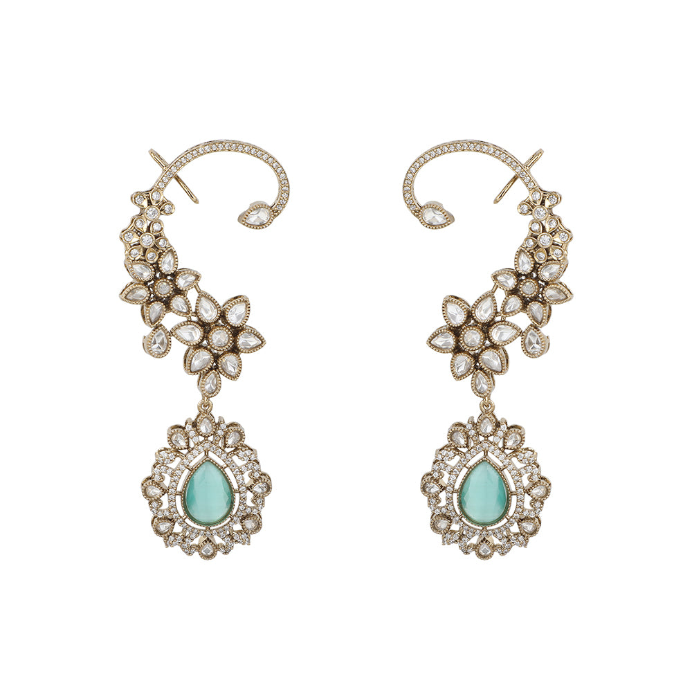Gold floral kundan ear cuff earrings with green teardrop gemstone and intricate design