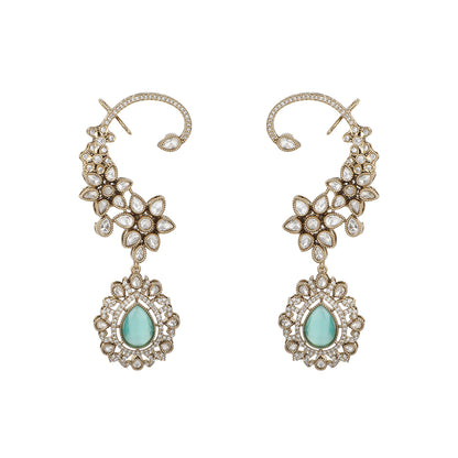 Gold floral kundan ear cuff earrings with green teardrop gemstone and intricate design