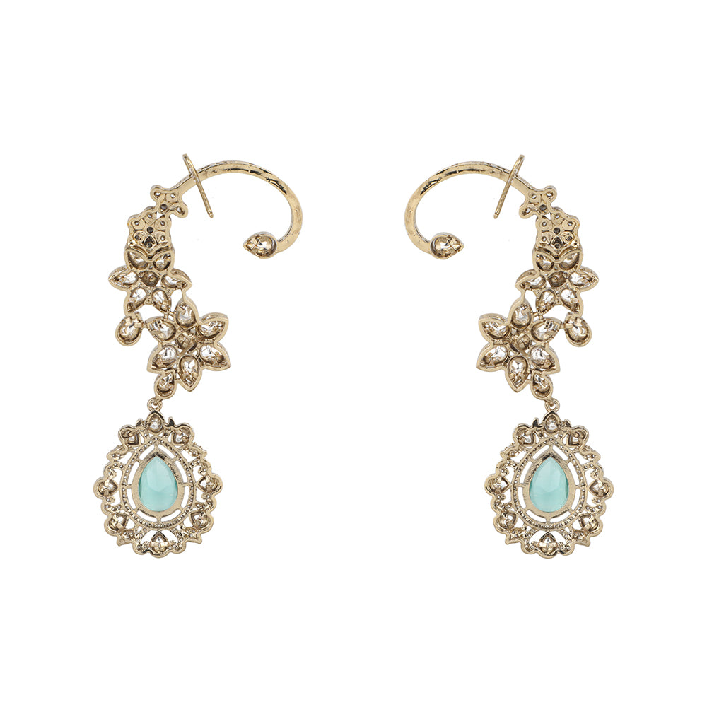 Gold floral kundan ear cuff earrings with green teardrop gemstone and intricate design