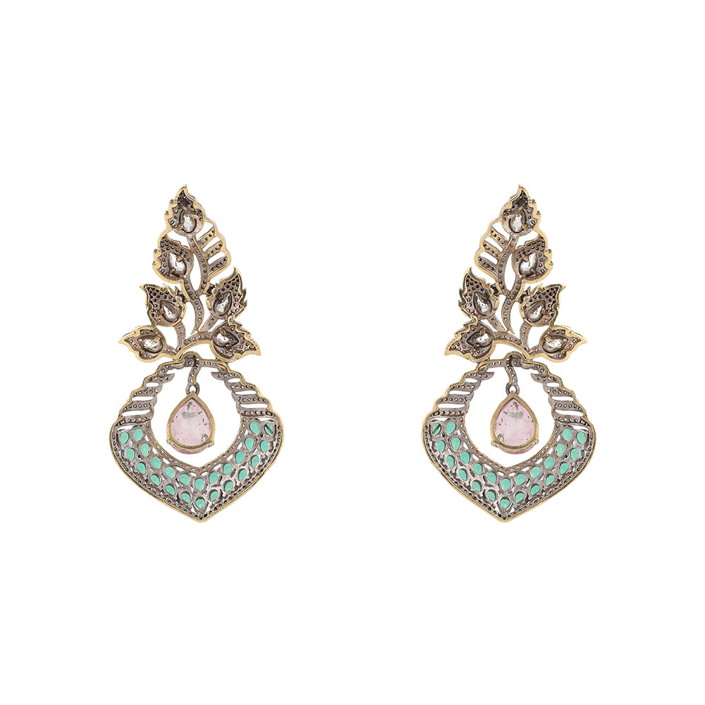 Gold plated American diamond earrings with leaf design, green stones and pink drop hanging centerpiece on white background