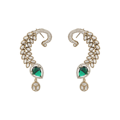 Gold plated American diamond ear cuff earrings with green teardrop stone and leaf design on white background