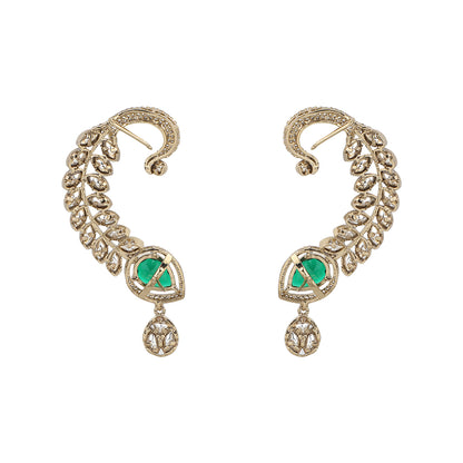 Gold plated American diamond ear cuff earrings with green teardrop stone and leaf design on white background
