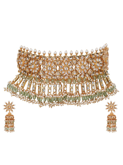 exquisite jewelry set features a stunning gold necklace paired with elegant earrings