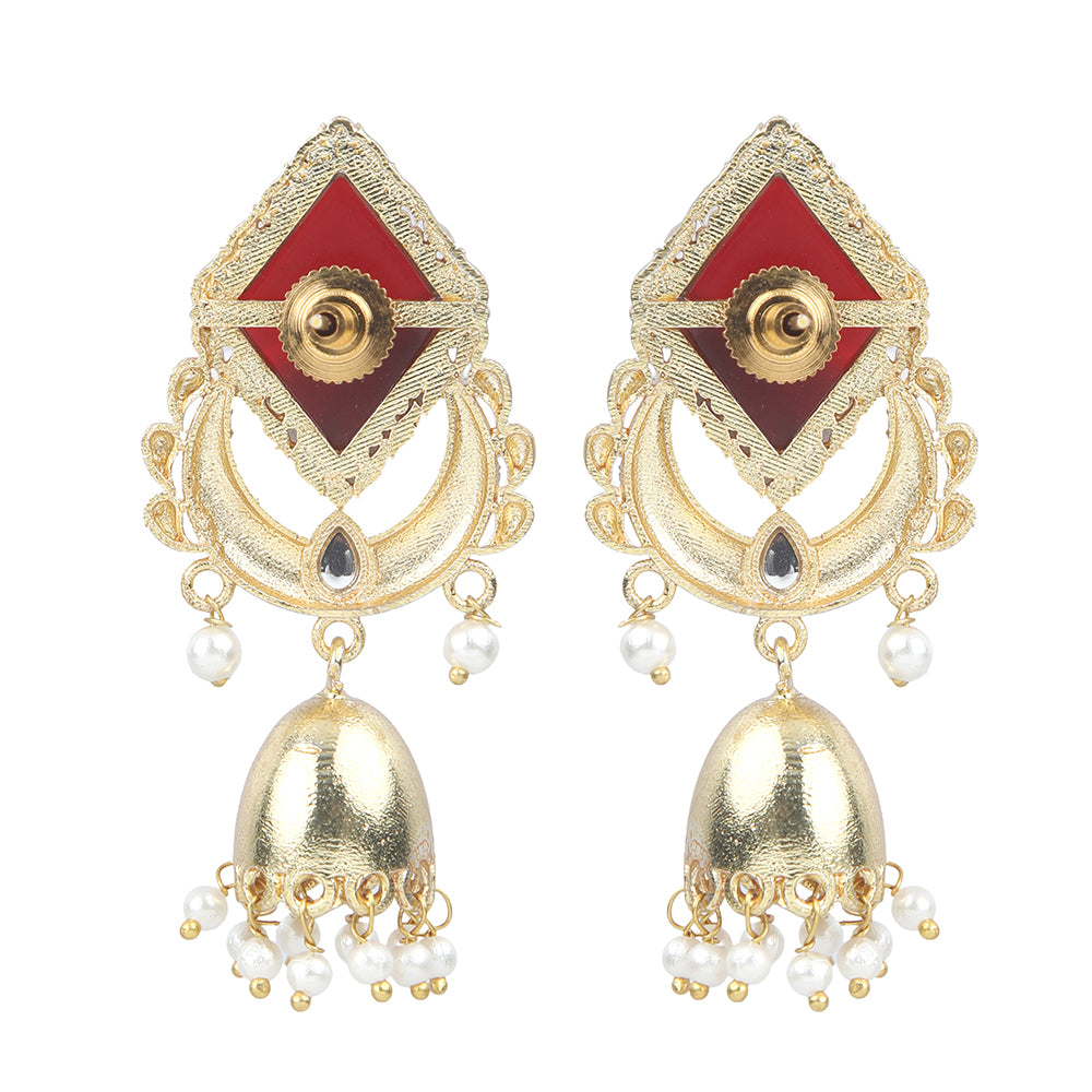 Gold jhumka earrings with red gemstone top, circular design, and pearl drop danglers on neutral background