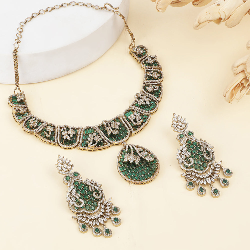 Gold plated statement necklace set with green stones and matching chandelier earrings for bridal and festive wear