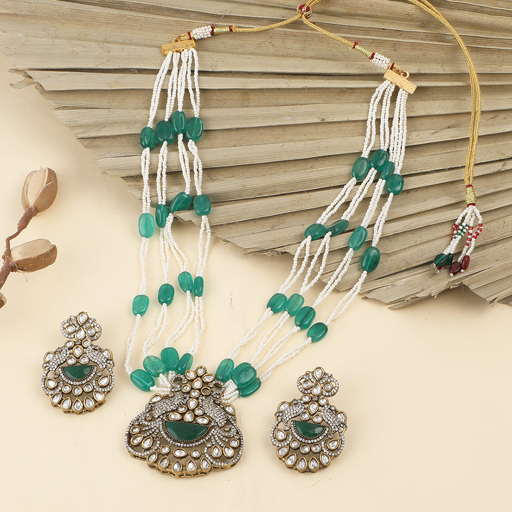 Green beaded Kundan long necklace set with pearl strands and matching traditional earrings for bridal and festive wear