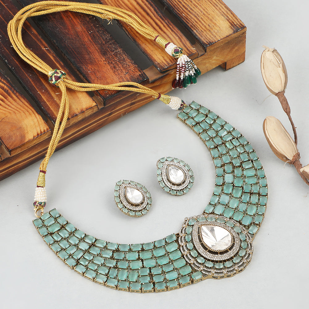 Gold plated mint green choker necklace set with teardrop pendant and matching earrings for bridal and party wear