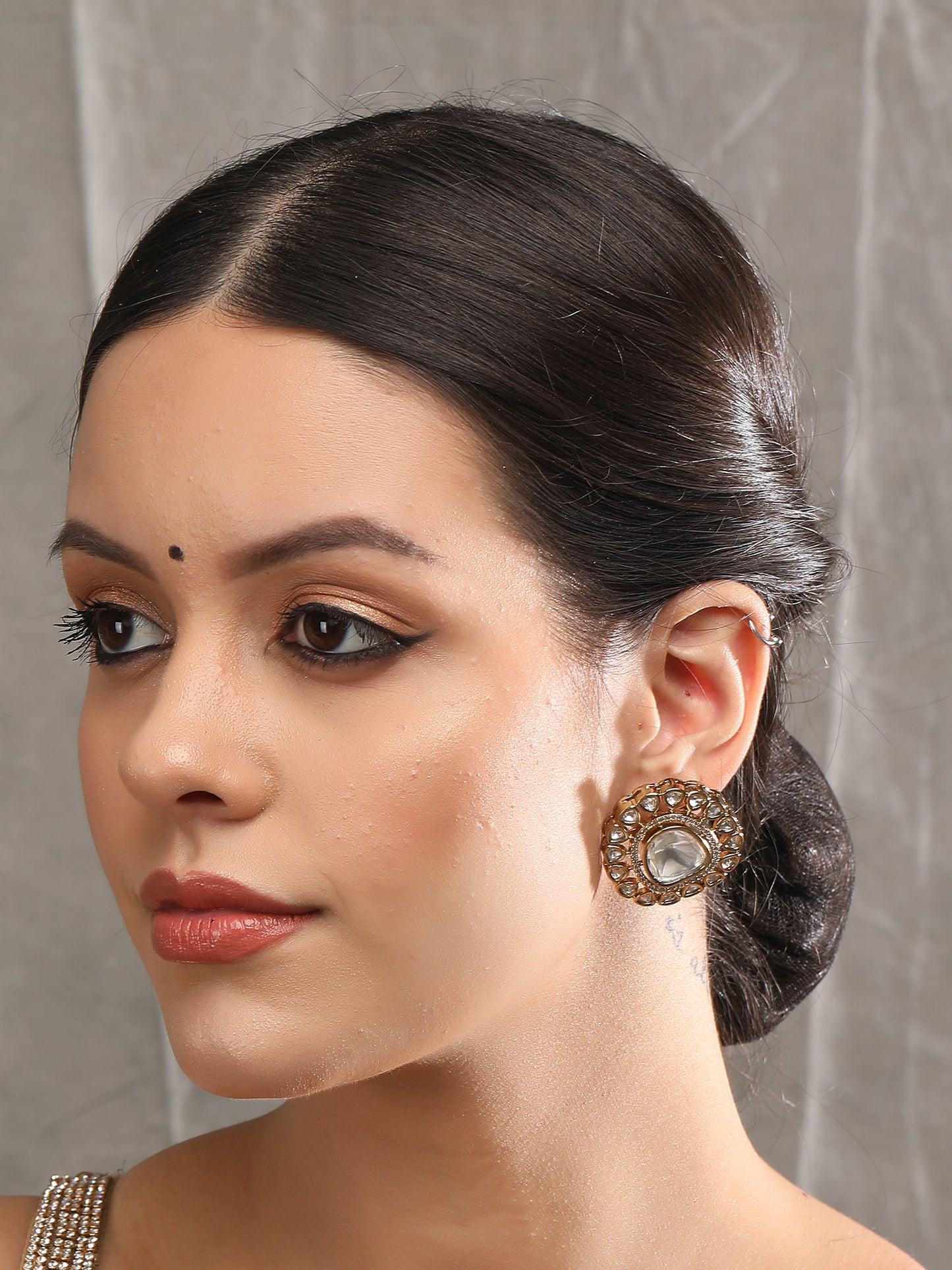 Elegant Gold Finish Chaandbaali Earrings with Emerald Accents Earrings