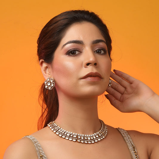 Gold polki Kundan choker necklace set with uncut stones and matching earrings for bridal and traditional Indian wear