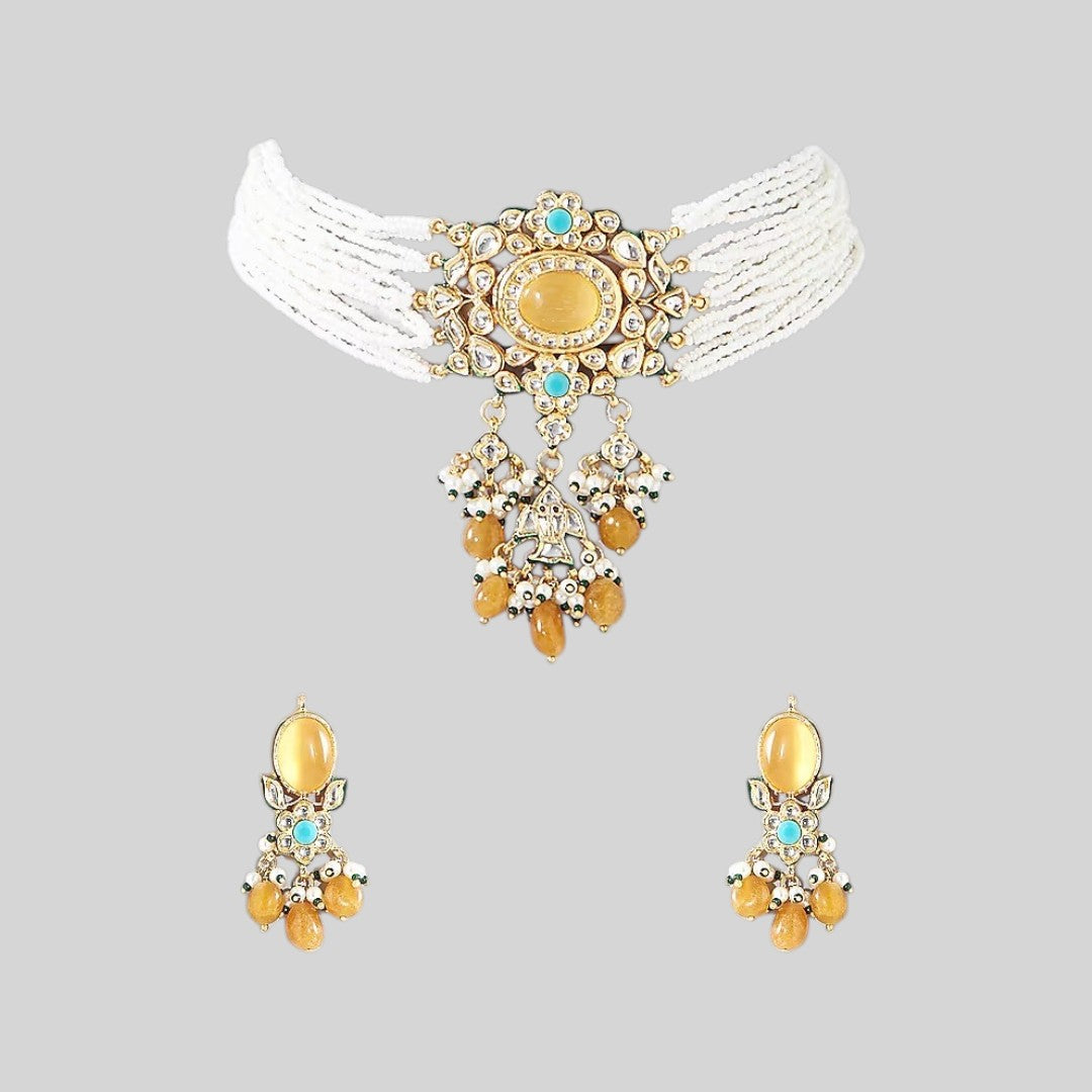 Multi-strand white beaded kundan choker necklace with yellow stone centrepiece and yellow bead drops, shown with matching earrings