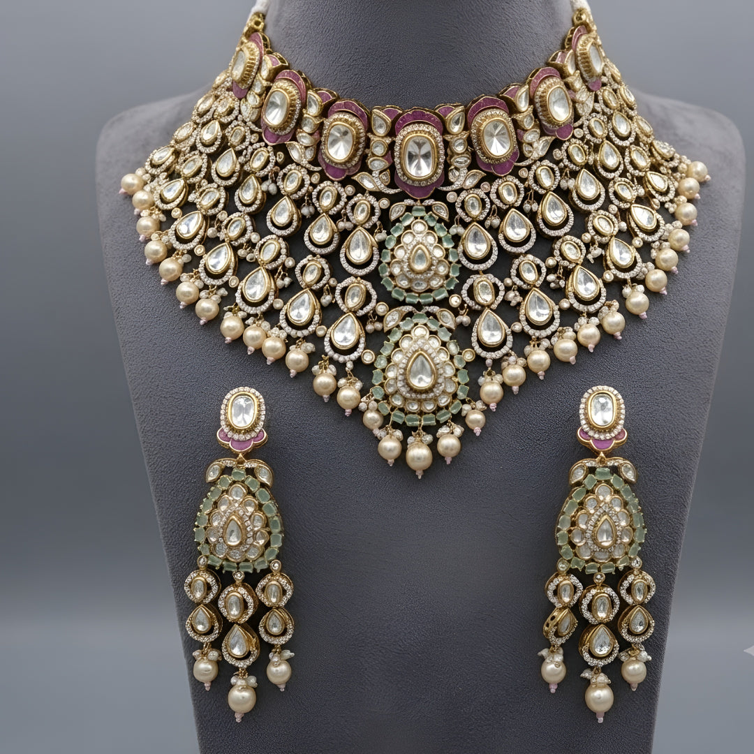 "Antique gold kundan meenakari bridal choker necklace set with pink and mint enamel work and pearl drops, paired with matching jhumka earrings"