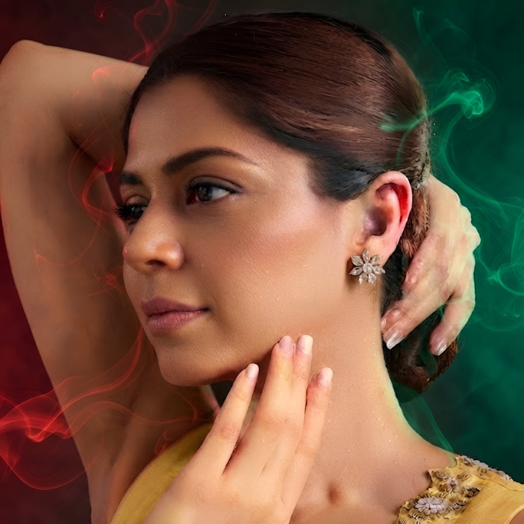 Gold-tone flower-shaped stud earrings with iridescent faceted crystal stones, front-facing pair