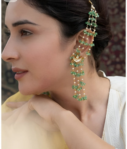 "Gold ear cuff earring with cascading green onyx beads and pearls, worn by model with dark hair in updo"