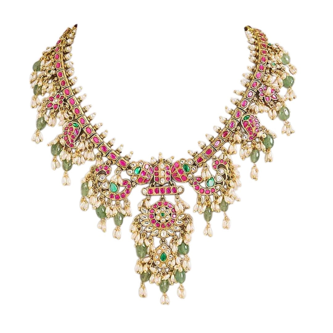 Pink and green Kundan-style necklace set with statement pendant and matching earrings
