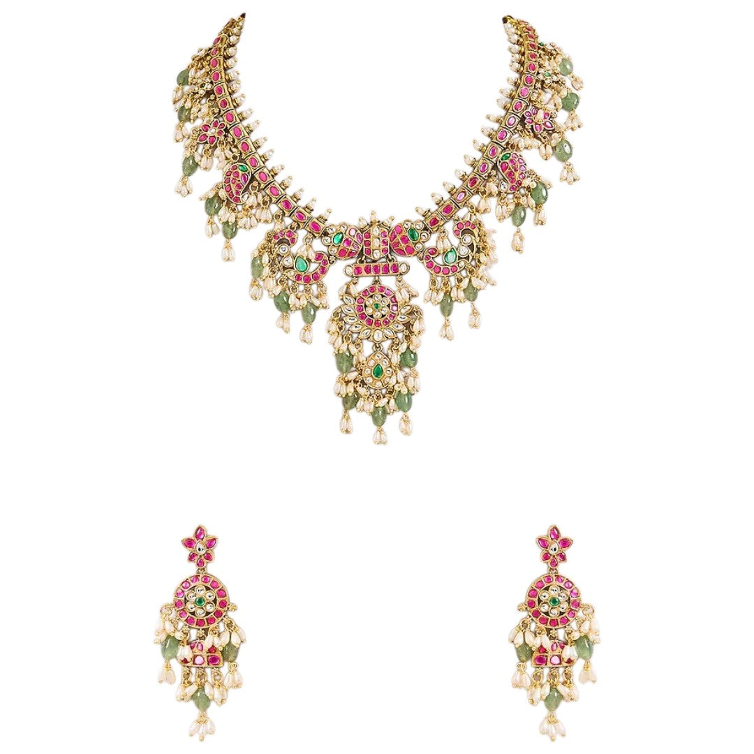 Pink and green Kundan-style necklace set with statement pendant and matching earrings